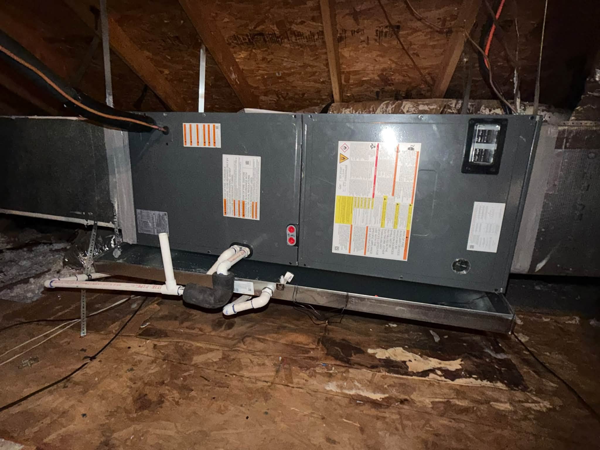 Air handler and condensate piping in an attic