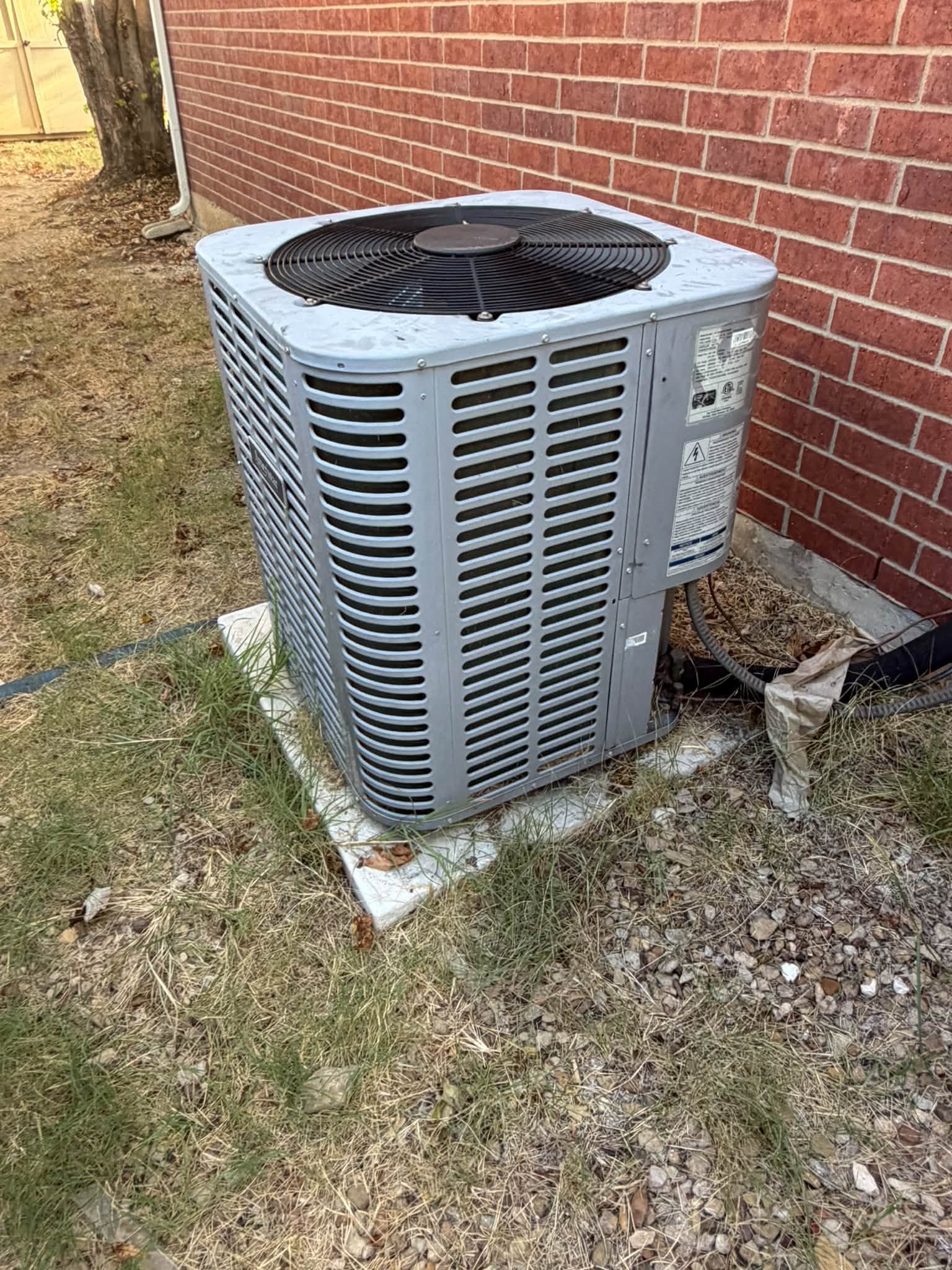 Outdoor condensing unit on a concrete pad